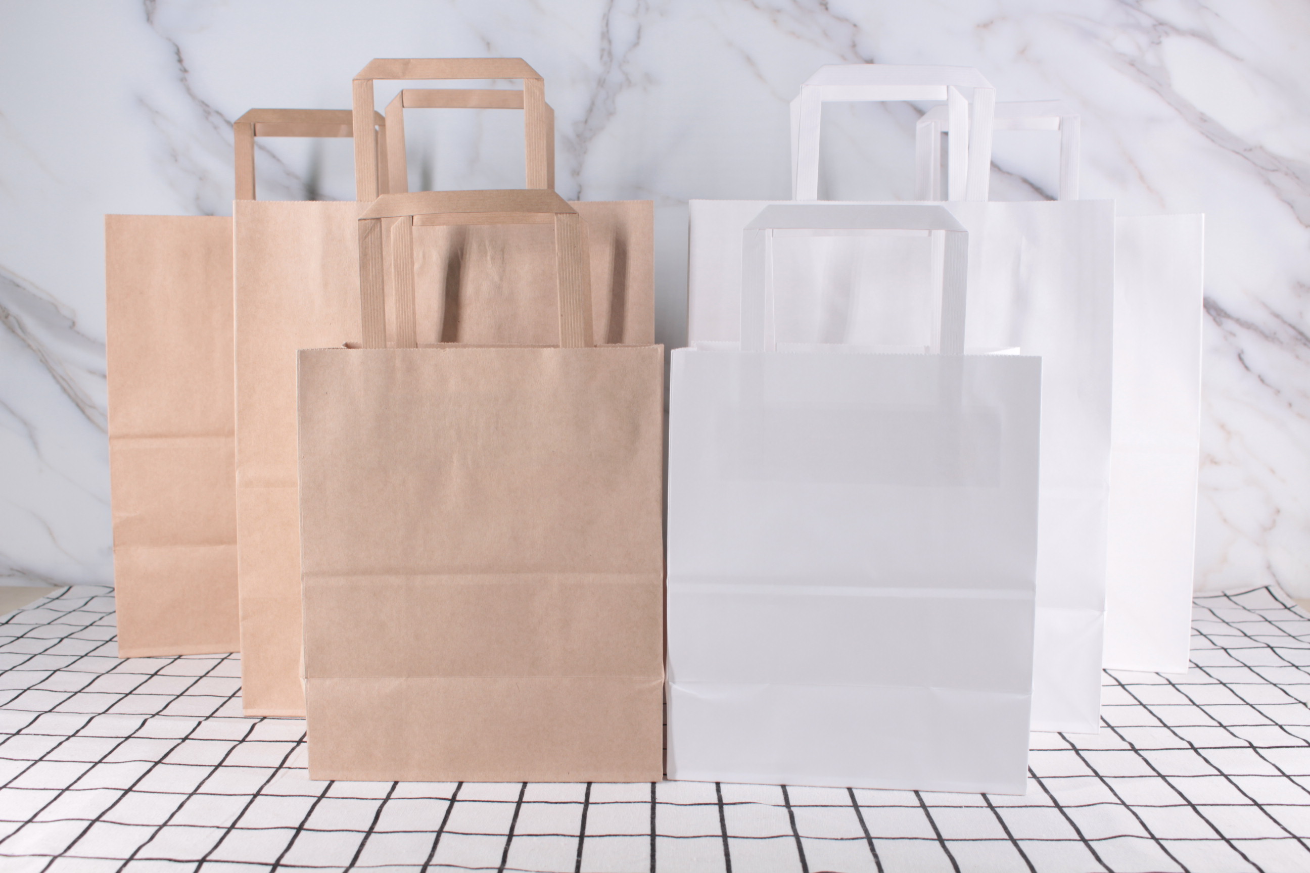 Stock white and brown kraft paper bag
